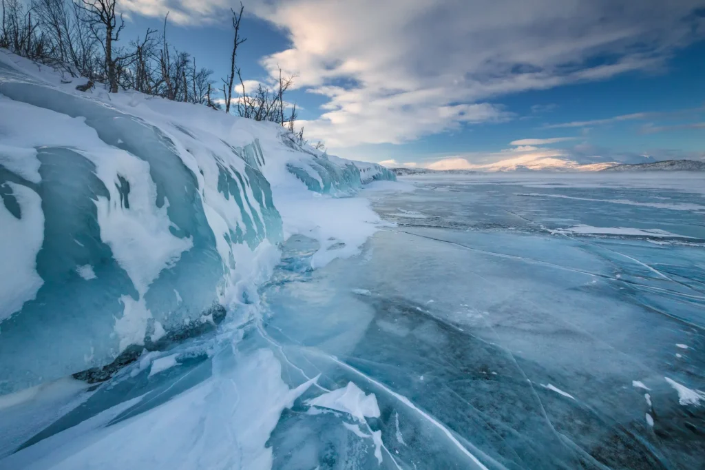 The frozen lake Torneträsk in Swedish Lapland. Beautiful ice forms create an amazing sight.