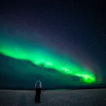 Girl watching the Northern Lights. Abisko Sweden