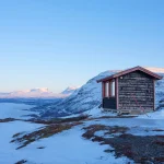 Cabin in snow on mountain